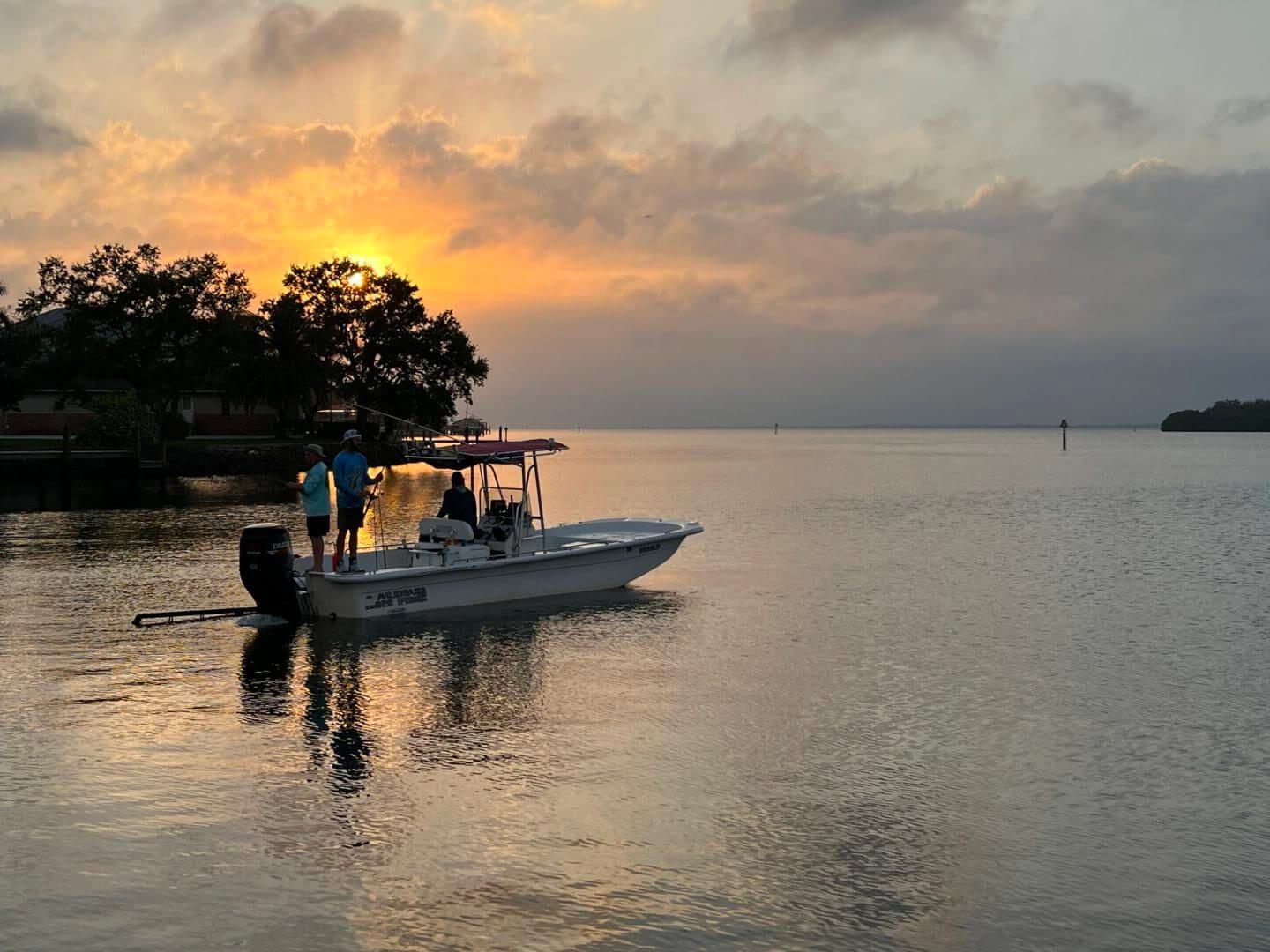 Sunset fishing adventure with anglers on a boat, available at Salty Dog Fishing Charters-Johns Pass-Treasure Island.